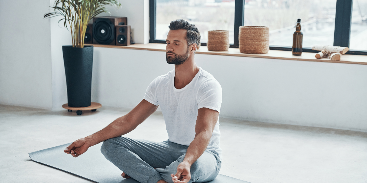 mindfully meditating man